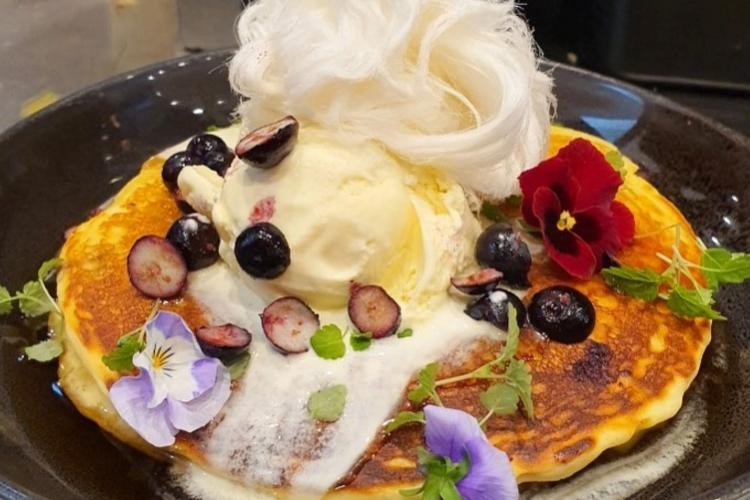 topped with orange curd, vanilla bean ice cream and persian fairy floss