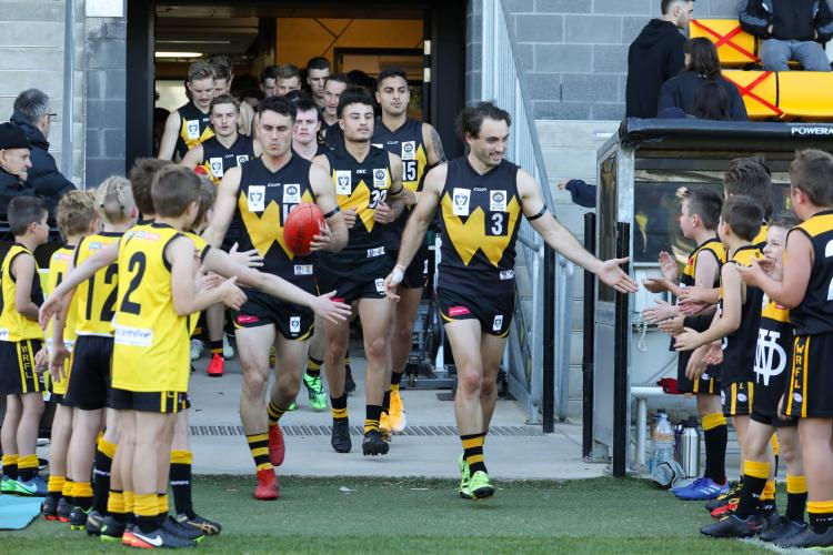 Werribee Football team walking onto ground