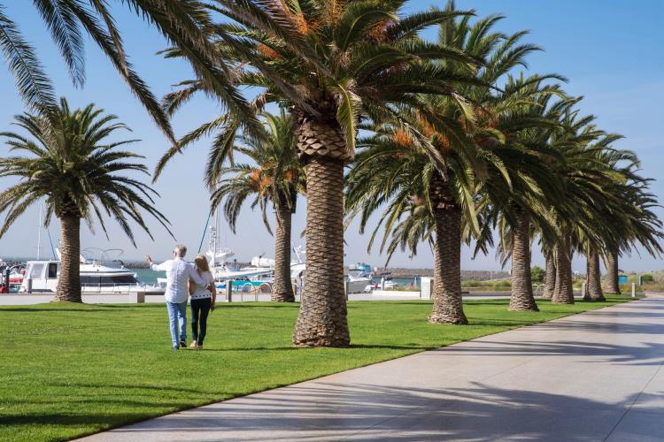 Image 4: couple walking at wyndham harbour