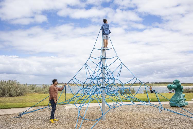 Image 2: family playing on playground