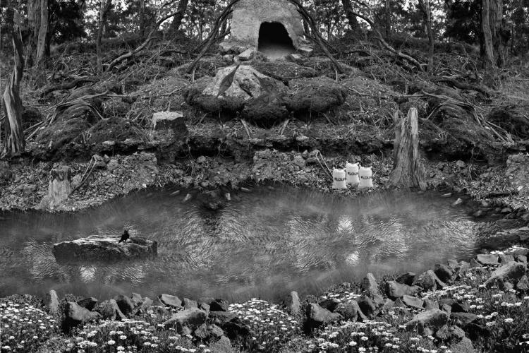 Photographic artwork by Hayley Millar Baker depicting a campsite by a river with bags of flour.