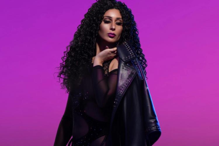 Woman with long hair against purple background