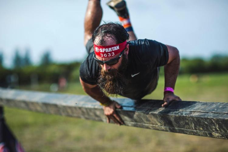 A person competes in Spartan Race.
