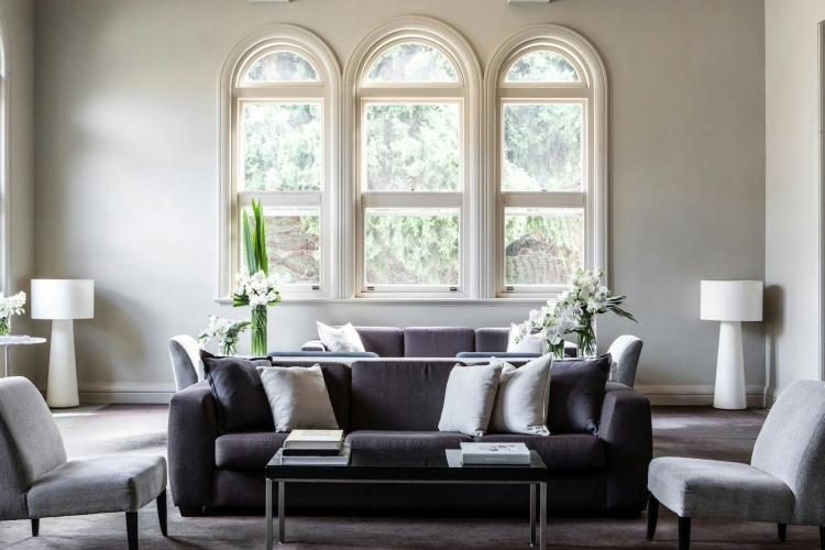 Heritage lounge with arched windows at Lancemore Mansion Hotel Werribee Park.
