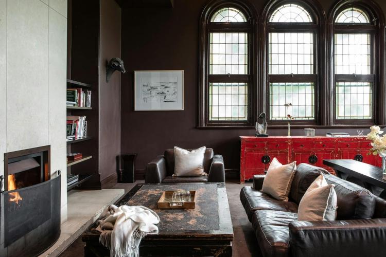 Heritage Mansion Library at Lancemore Mansion Hotel, featuring original fireplace and arched windo