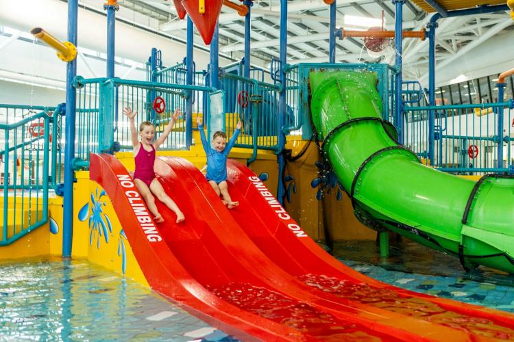 Kids going down water slide