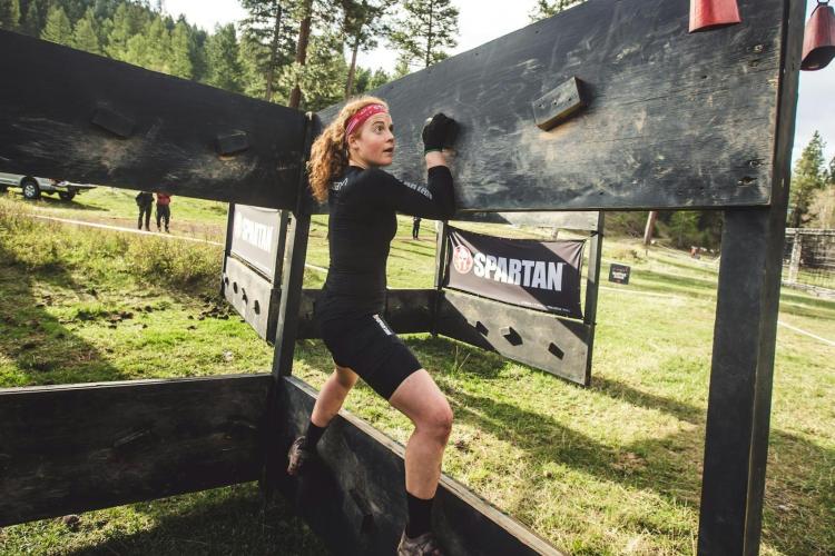 A person competes in Spartan Race.