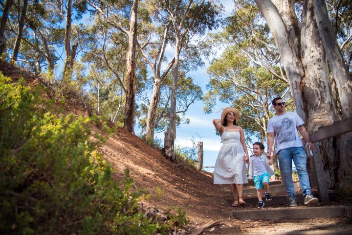 Family walking along a path to the Werribee River