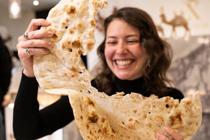 Sofia Levin from Seasoned Traveller eating bread