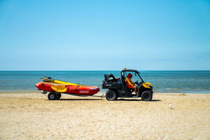 life guards in patrol buggy on sand of Werribee South Beach