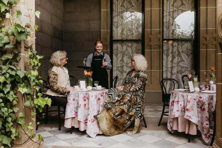 two women having high tea under the Mansion eaves at The Refectory Parlour